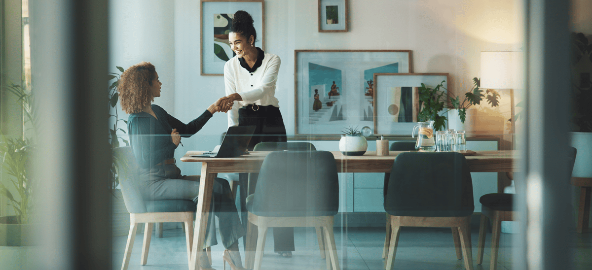 Business woman shaking hands email header image