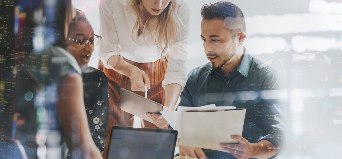 Group of people discussing documents email header image
