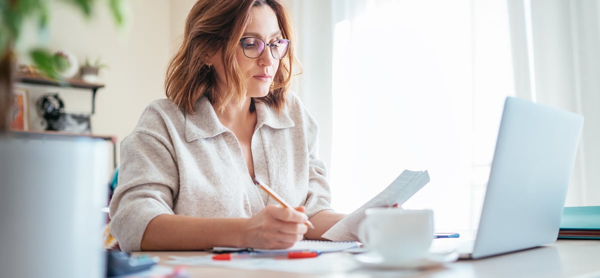 Woman writing with pencil email header image